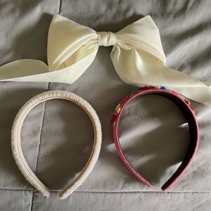 Hair accessories bundle: two headbands and one bow clip.